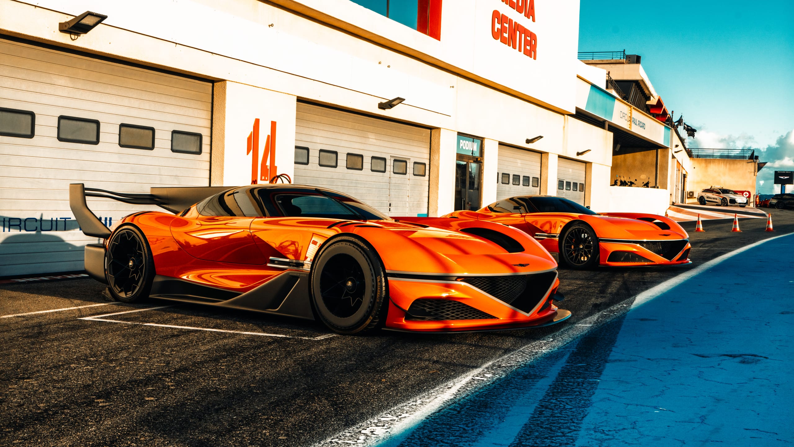Genesis performance vehicles lined up on the Paul Ricard circuit during the Magma Racing activation